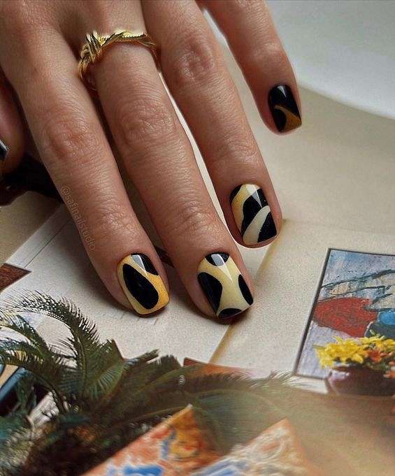 Yellow nail polish for women the handles with the design of the black twigs  on camouflage